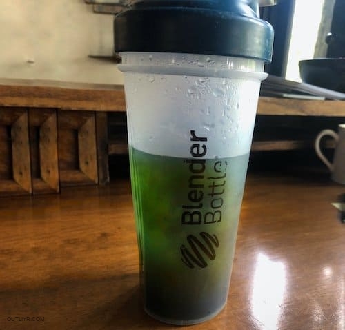 Blender bottle full of homemade pre-workout ingredients.